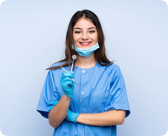 Professional dentist holding dental mirror and tools representing modern dental care services
